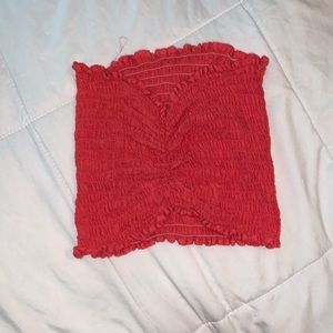 Ribbed pink tube top that pinched in at top and bottom